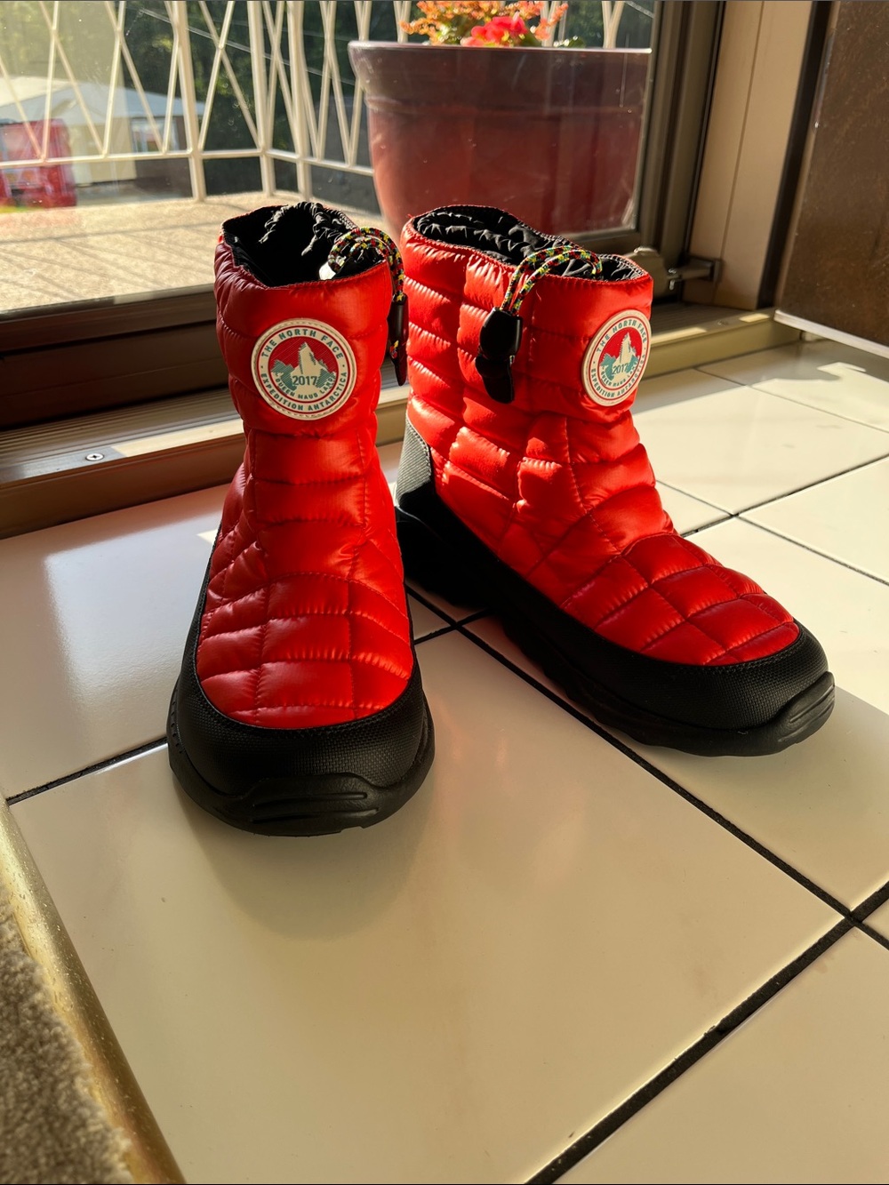 The North Face Men’s Red Puffer Winter Boots